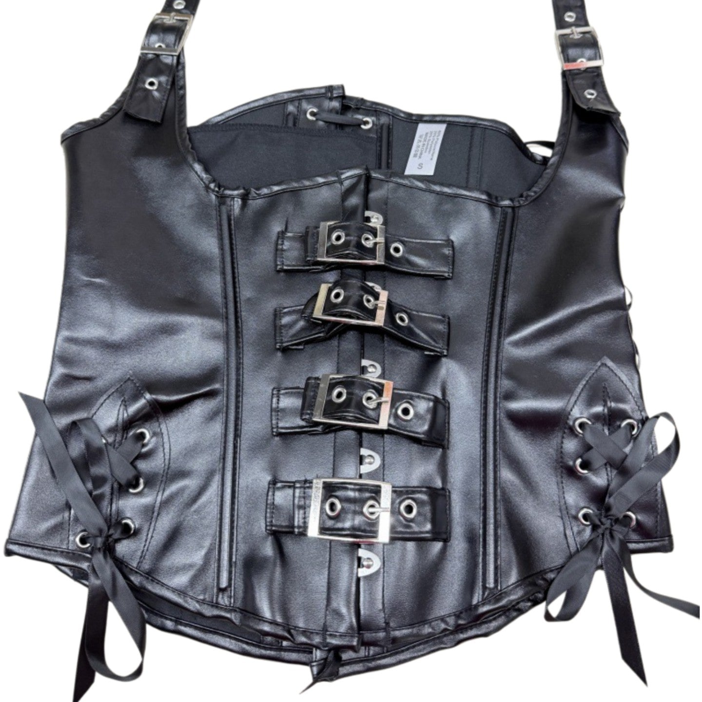 Primer plano de corset underbust con hebillas metálicas y cintas laterales.